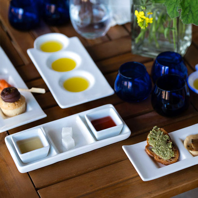 Gourmet tasting experience at Round Pond Estate featuring a plated selection estate olive oils and vinegars.